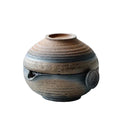 Ceramic chawan with striped design on a white background