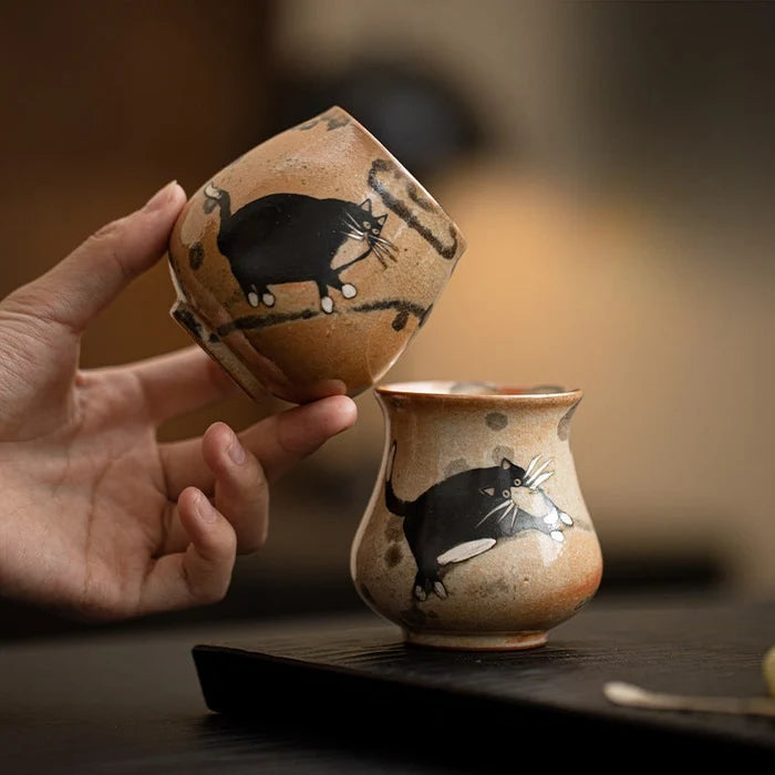 Two tea cups with black painted cats.