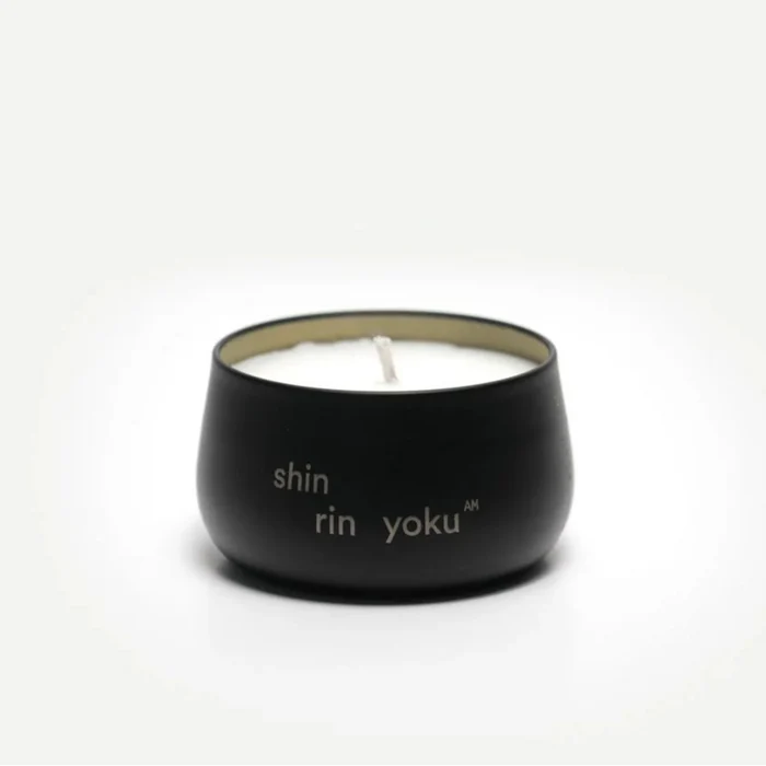 Black candle holder with 'shin rin yoku' text on a white background