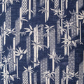 Navy blue fabric with a white bamboo design and traditional Japanese patterns