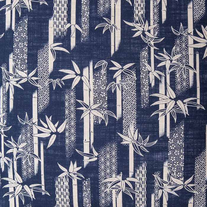 Navy blue fabric with a white bamboo design and traditional Japanese patterns