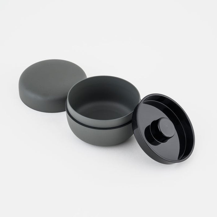 Gray ceramic tea holder with lids on a white background