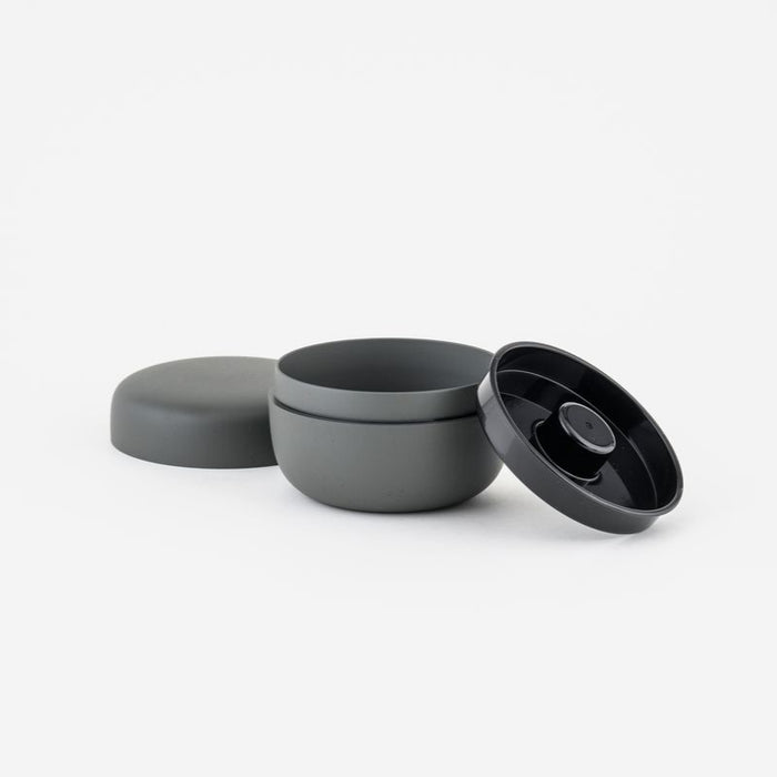 Gray container with lids on a white background