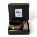 Ceramic tea bowl and whisk set in a black box with Nagomi branding.