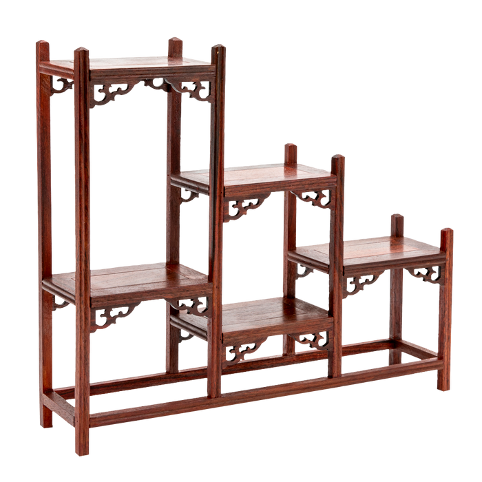 A traditional Japanese ornate rosewood shelf with scroll detailing and a stagnated 'step' design.