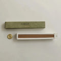 Incense set with 'FOREST' packaging on a light background