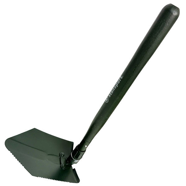 An olive green tactical shovel with a serrated blade and a wooden handle, shown on a plain white background. The handle features the brand name 'stansport' printed in white.