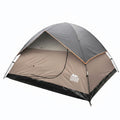 A dome-style camping tent in tan with a gray rain-fly and black floor, shown at a left angle on a plain white background.
