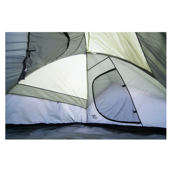 an internal view of the tent looking towards a closed door